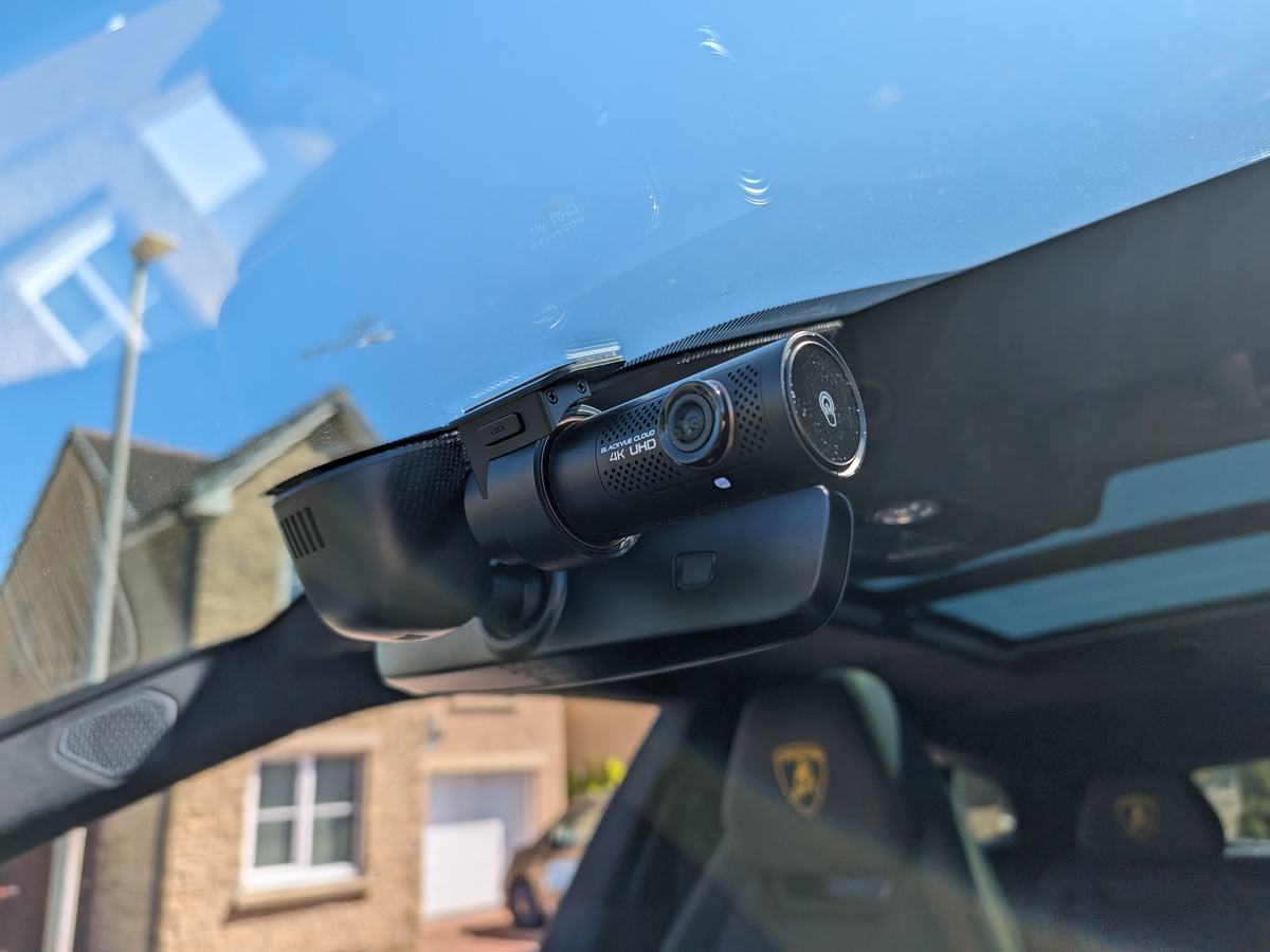 BlackVue DR970X 4K dash cam fitted behind the rear-view mirror of a Lamborghini Urus