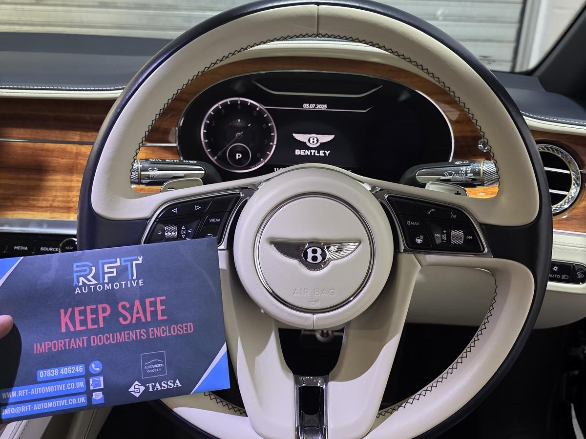Bentley steering wheel with the RFT Automotive Keep Safe card after a Ghost immobiliser install